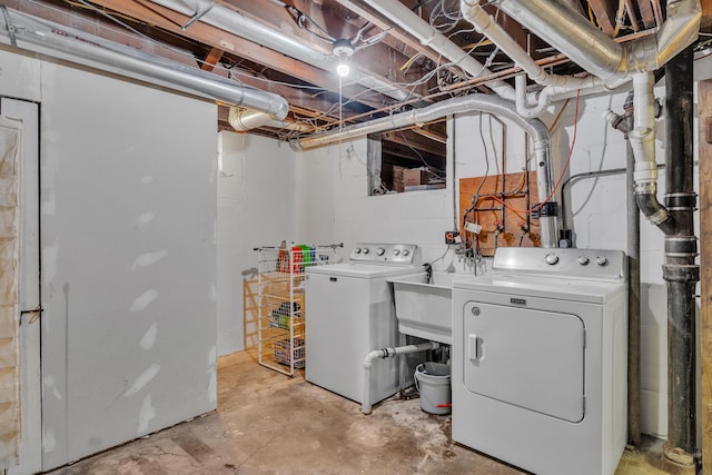 clothes washing area with laundry area and washer and dryer