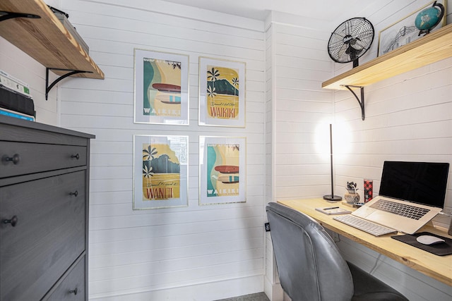 office area with wooden walls