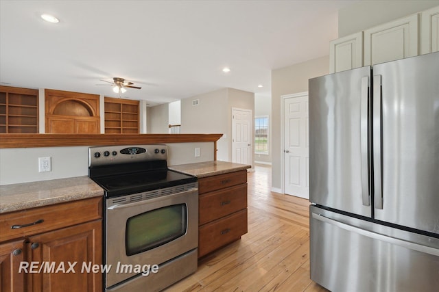 kitchen featuring ceiling fan, open shelves, brown cabinetry, stainless steel appliances, and light wood-type flooring