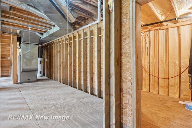unfinished below grade area with heating unit and water heater