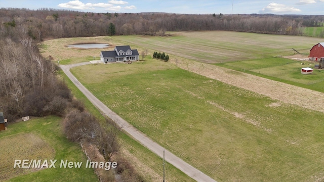 birds eye view of property with a forest view