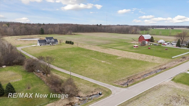 birds eye view of property with a rural view