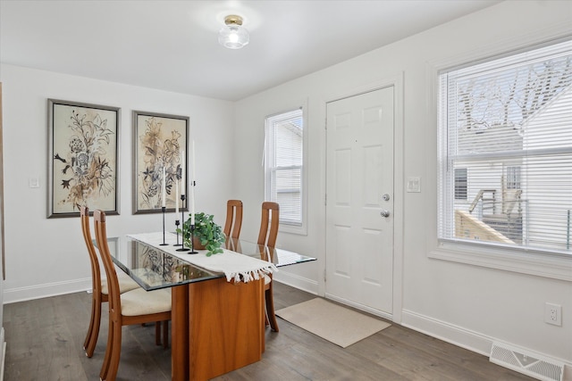 224 N Hewitt Rd, Ypsilanti, MI 48197 - dining area with dark wood finished floors and baseboards