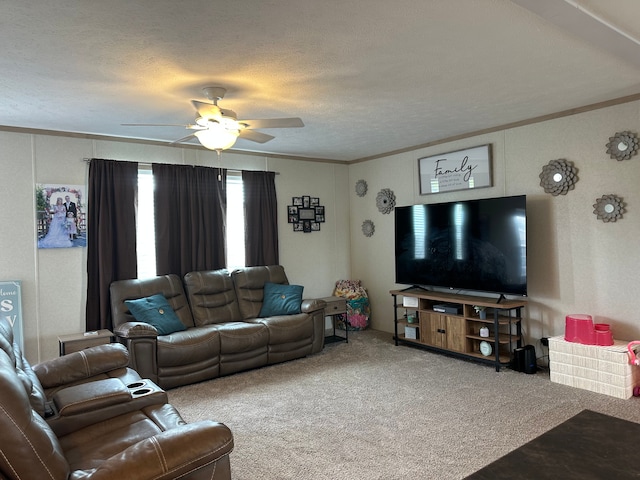 carpeted living area with crown molding, a textured ceiling, and ceiling fan