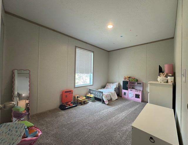 bedroom with crown molding, carpet floors, and a decorative wall