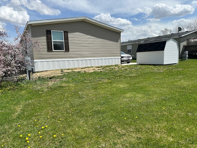 view of property exterior featuring a lawn, an outdoor structure, and a storage unit