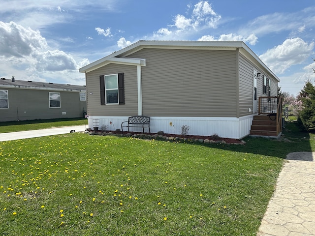 view of home's exterior featuring a yard