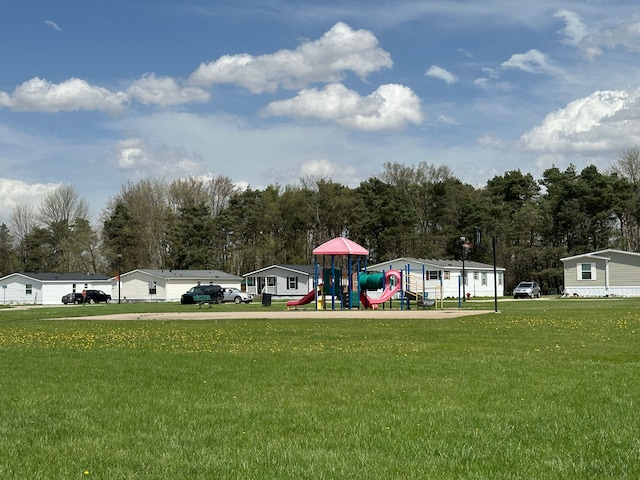 exterior space with a lawn and playground community