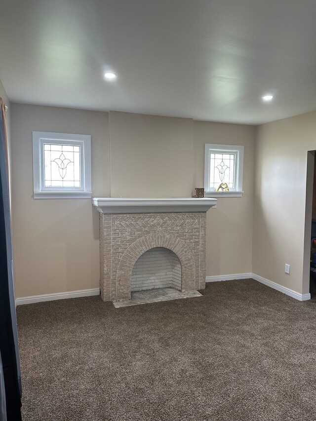 unfurnished living room with plenty of natural light, carpet, and recessed lighting
