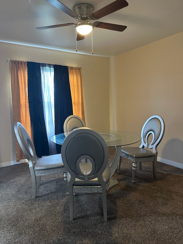 carpeted dining area featuring ceiling fan and baseboards