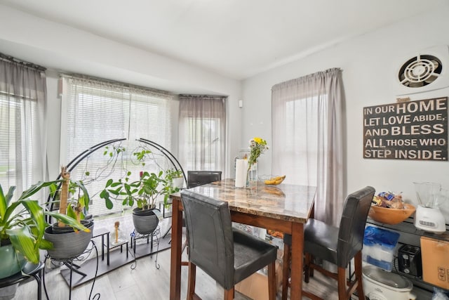 14141 Edmore Dr, Detroit, MI 48205 - dining space featuring light wood finished floors and a healthy amount of sunlight