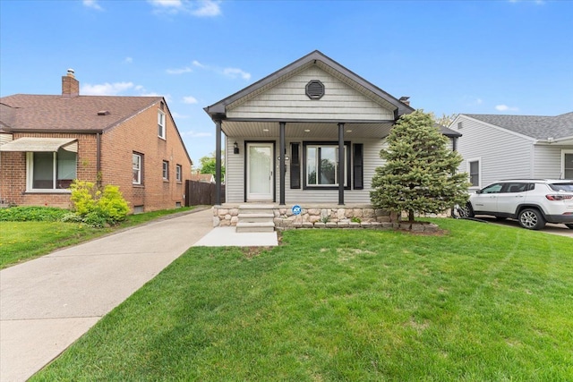 7960 Jackson St, Taylor, MI 48180 - view of front of property with a porch and a front lawn