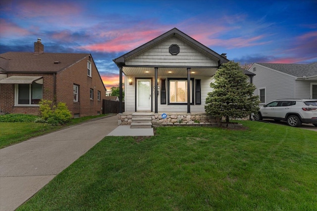 7960 Jackson St, Taylor, MI 48180 - view of front of property featuring covered porch and a front lawn