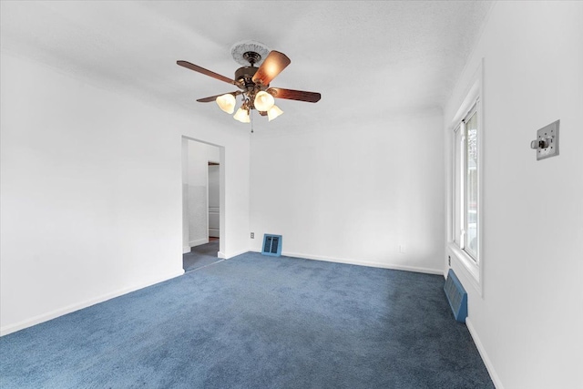 7960 Jackson St, Taylor, MI 48180 - empty room featuring a ceiling fan, baseboards, dark colored carpet, and visible vents