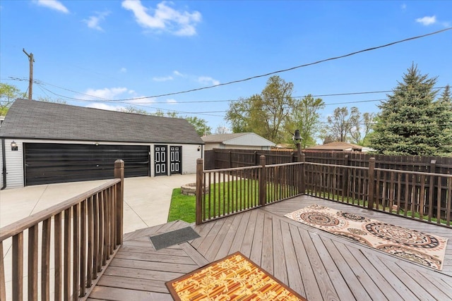 7960 Jackson St, Taylor, MI 48180 - wooden deck featuring an outdoor structure, fence, and a detached garage