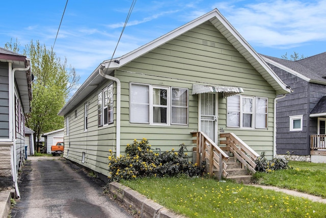 bungalow-style home featuring entry steps