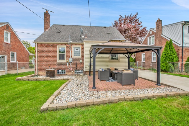 back of property featuring a gazebo, outdoor lounge area, a fenced backyard, a patio area, and a lawn