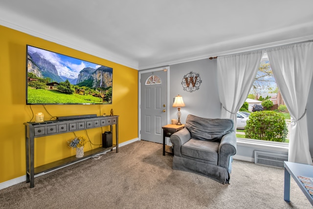 sitting room featuring carpet flooring, crown molding, visible vents, and baseboards