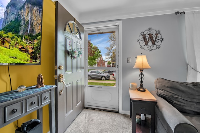 doorway with baseboards and carpet flooring