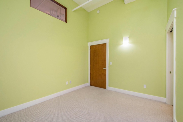 unfurnished bedroom with carpet flooring and baseboards
