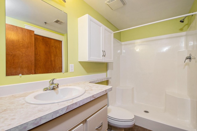 full bath with vanity, visible vents, and a shower