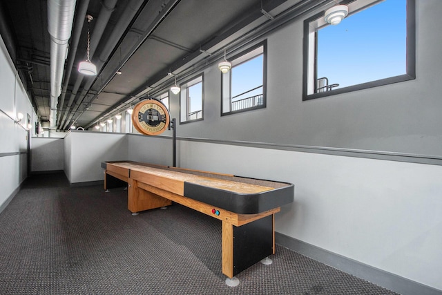 rec room featuring baseboards and carpet