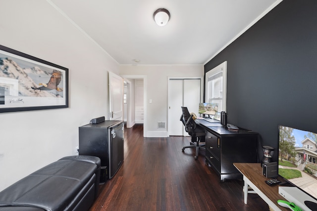 office with crown molding, wood finished floors, and visible vents
