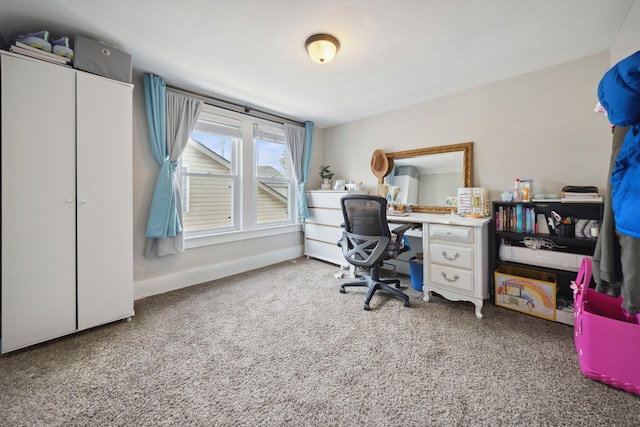 office space with baseboards and carpet flooring