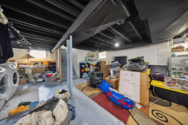 finished below grade area featuring washer and clothes dryer