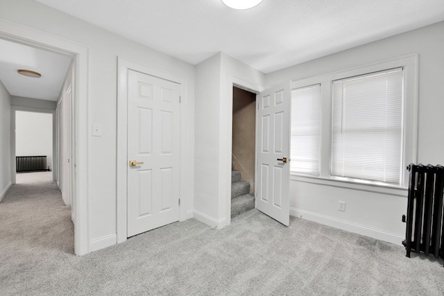 16560 Ashton Ave, Detroit, MI 48219 - unfurnished bedroom featuring carpet flooring, radiator, and baseboards