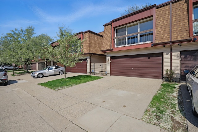 25030 Sherwood Cir, Southfield, MI 48075 - view of property featuring a garage, roof with shingles, mansard roof, and driveway