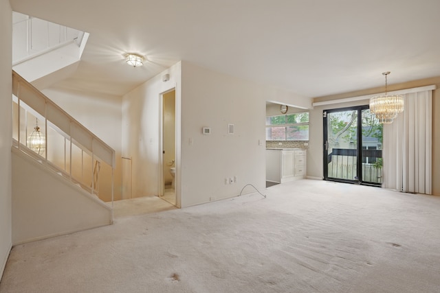 25030 Sherwood Cir, Southfield, MI 48075 - unfurnished living room featuring carpet floors, a notable chandelier, and stairs
