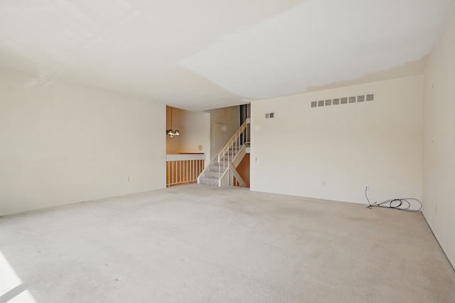 25030 Sherwood Cir, Southfield, MI 48075 - carpeted spare room with visible vents and stairway