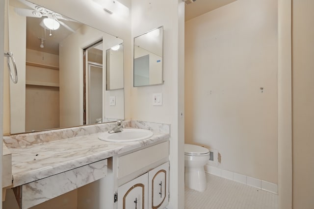 25030 Sherwood Cir, Southfield, MI 48075 - bathroom featuring tile patterned flooring, vanity, toilet, baseboards, and ceiling fan