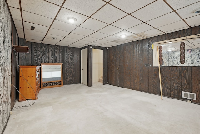 25030 Sherwood Cir, Southfield, MI 48075 - finished below grade area with wooden walls, a drop ceiling, and visible vents
