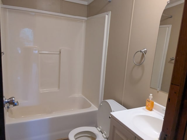 bathroom featuring toilet, tub / shower combination, and vanity