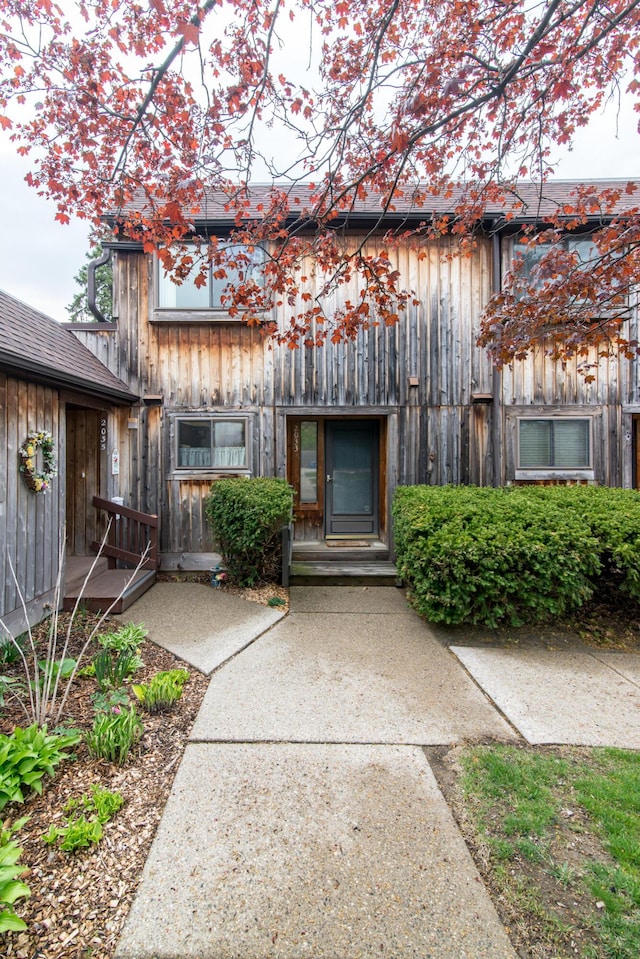view of exterior entry featuring board and batten siding