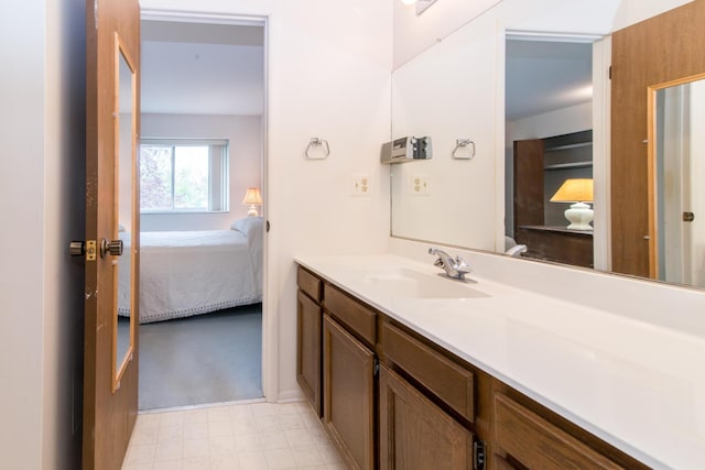 ensuite bathroom with vanity and ensuite bath