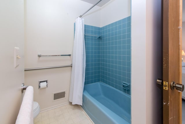 full bath with visible vents, shower / tub combo with curtain, and toilet