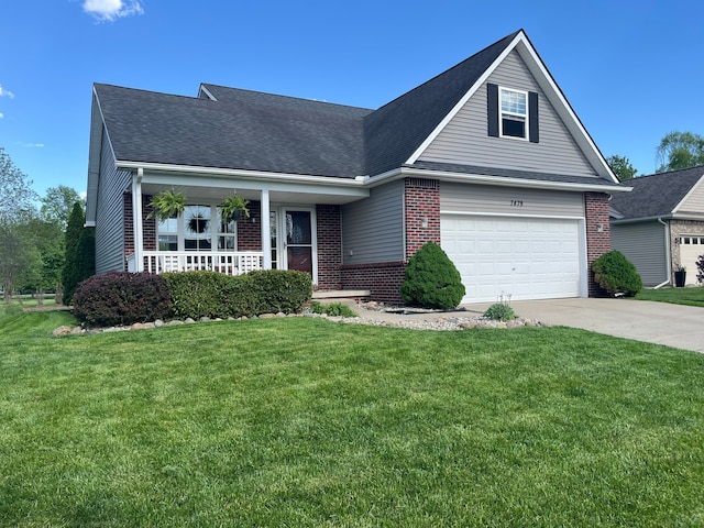 traditional home with brick siding, driveway, a front yard, covered porch, and a garage