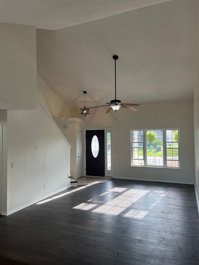 entrance foyer with baseboards, dark wood-style floors, and a ceiling fan