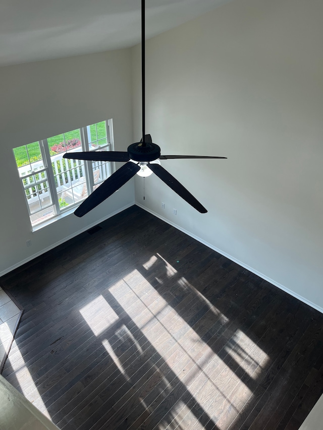 detailed view of wood finished floors, ceiling fan, and baseboards