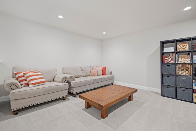 carpeted living room featuring baseboards and recessed lighting