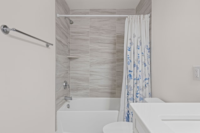 bathroom with vanity, toilet, and shower / bath combo