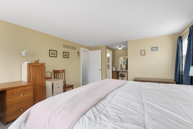 bedroom featuring visible vents