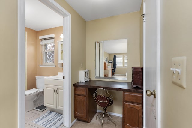 bathroom with toilet, tile patterned flooring, and vanity