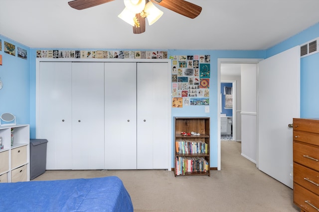 bedroom with ceiling fan, a closet, and carpet