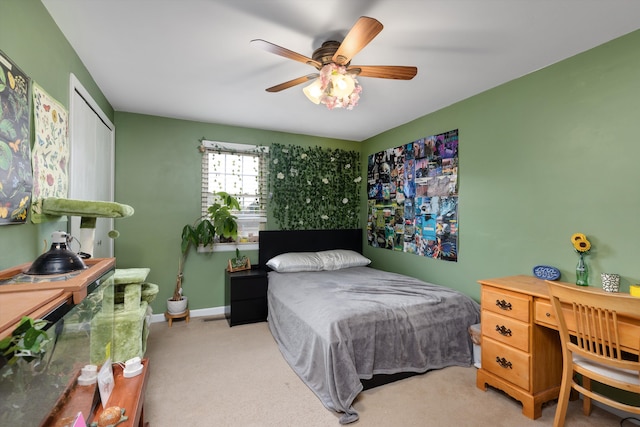 bedroom with carpet, a closet, and a ceiling fan