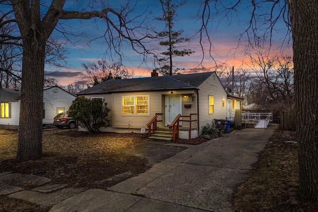 bungalow featuring a chimney