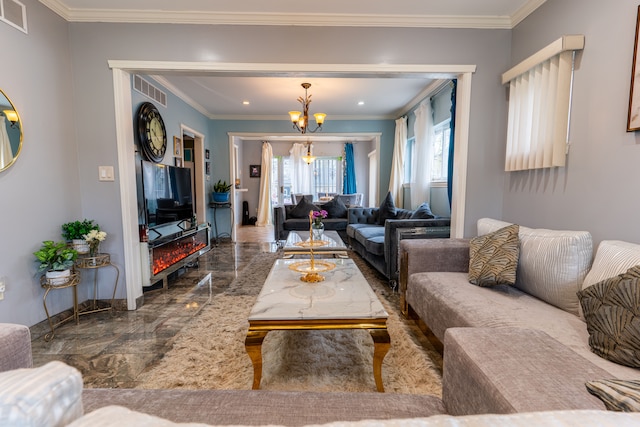 living room featuring visible vents, baseboards, crown molding, and a notable chandelier